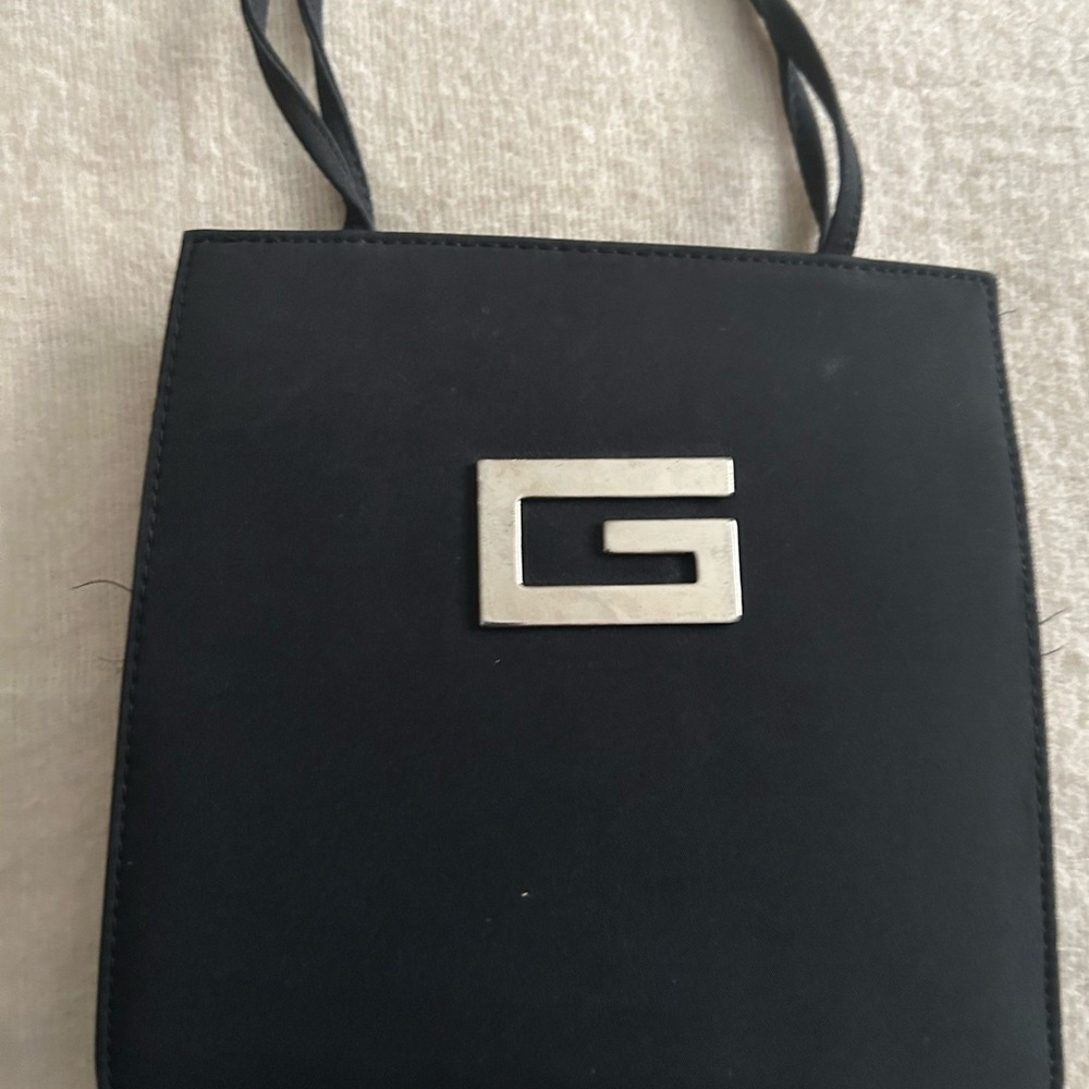 Black Shoulder Bag with Sleek Design and Structured Form